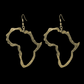 A large pair of Gold Plated Brass Africa-shaped earrings on a black background