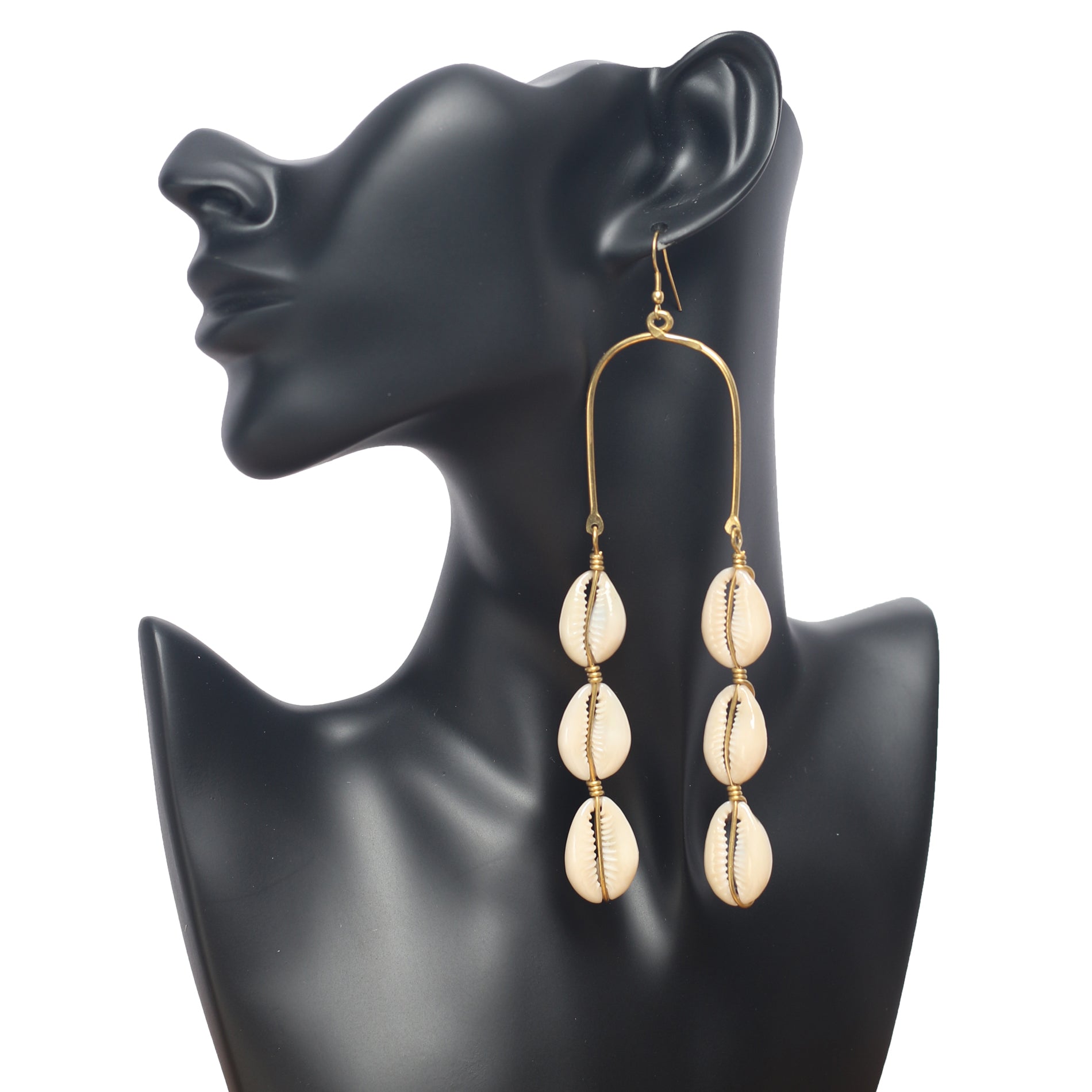 Long Shell Earrings. Made with gold plated brass and cowrie shells