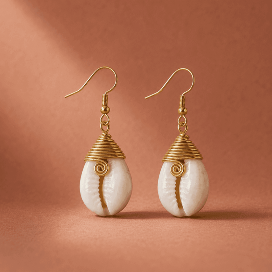 A pair of small gold and shell earrings