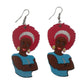 African Wooden Earrings shaped into the image of young woman wearing a red and white headwrap and blue top