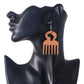 Afro comb wooden earrings with Africa cutout displayed on mannequin