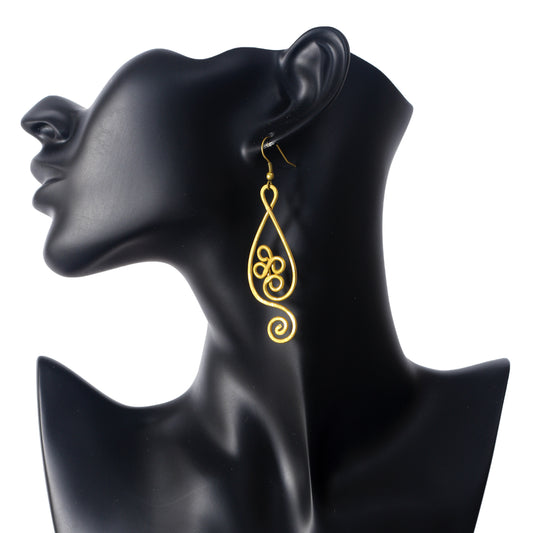A pair of large, gold-plated wire earrings in a sculptural teardrop shape with a central triple-loop and spiral design.