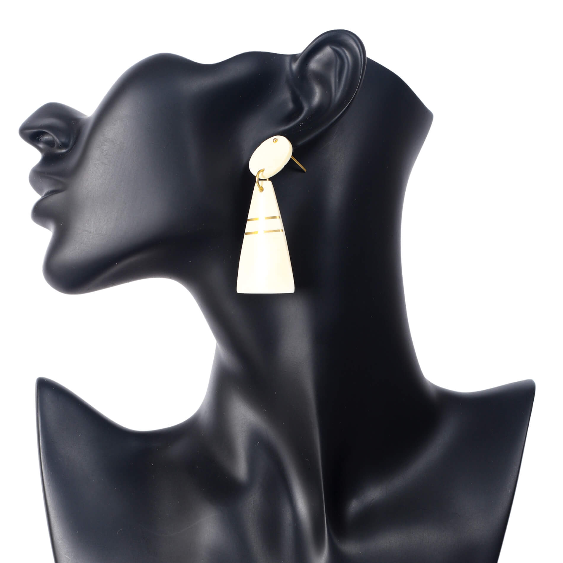 Handmade geometric camel bone earrings with an oval stud and cream tapered drop, accented with gold inlay lines.