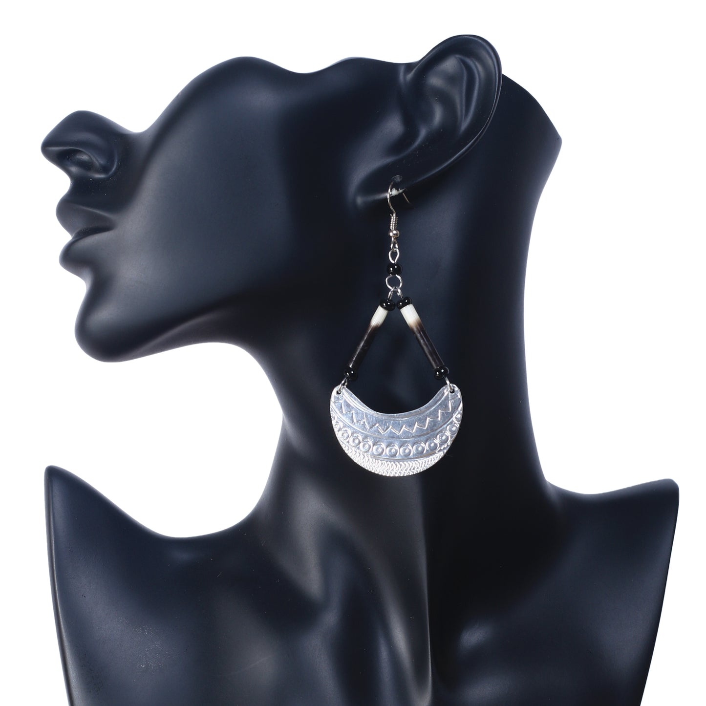 Statement dangle earrings featuring genuine porcupine quills and an etched silver-plated crescent pendant.
