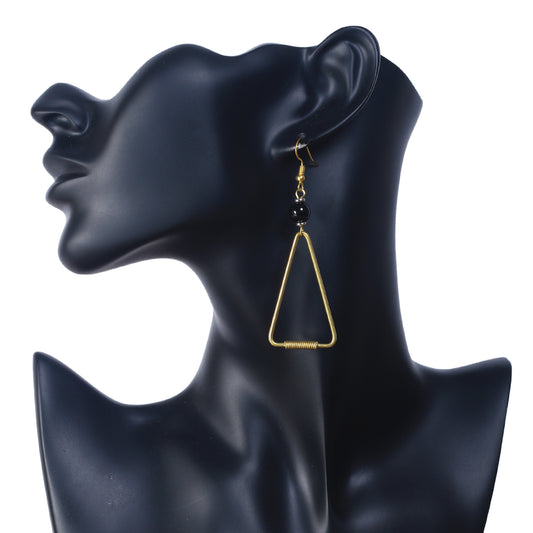 A pair of open-frame, gold-plated triangle earrings with a wire-wrapped base and black bead accents