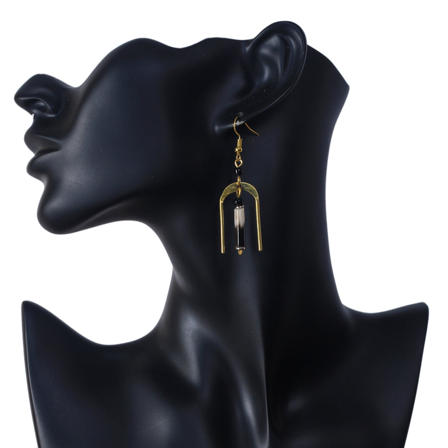 A pair of gold-plated, U-shaped arch earrings with a genuine porcupine quill dangling in the center.
