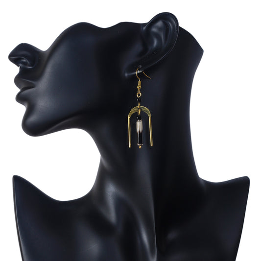 A pair of gold-plated, U-shaped arch earrings with a genuine porcupine quill dangling in the center.