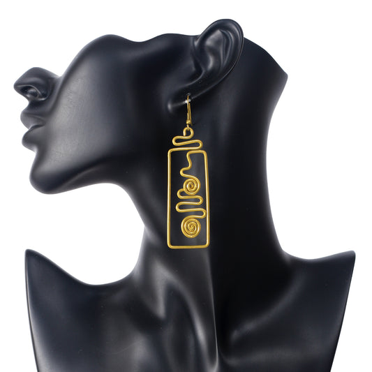 A pair of long, gold-plated geometric earrings with a rectangular frame and an abstract spiral wire design inside