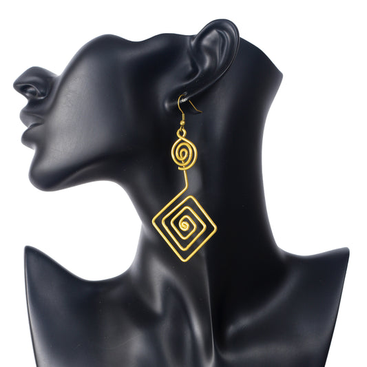 A pair of large, gold-plated geometric earrings with a round spiral stacked on a square spiral drop.