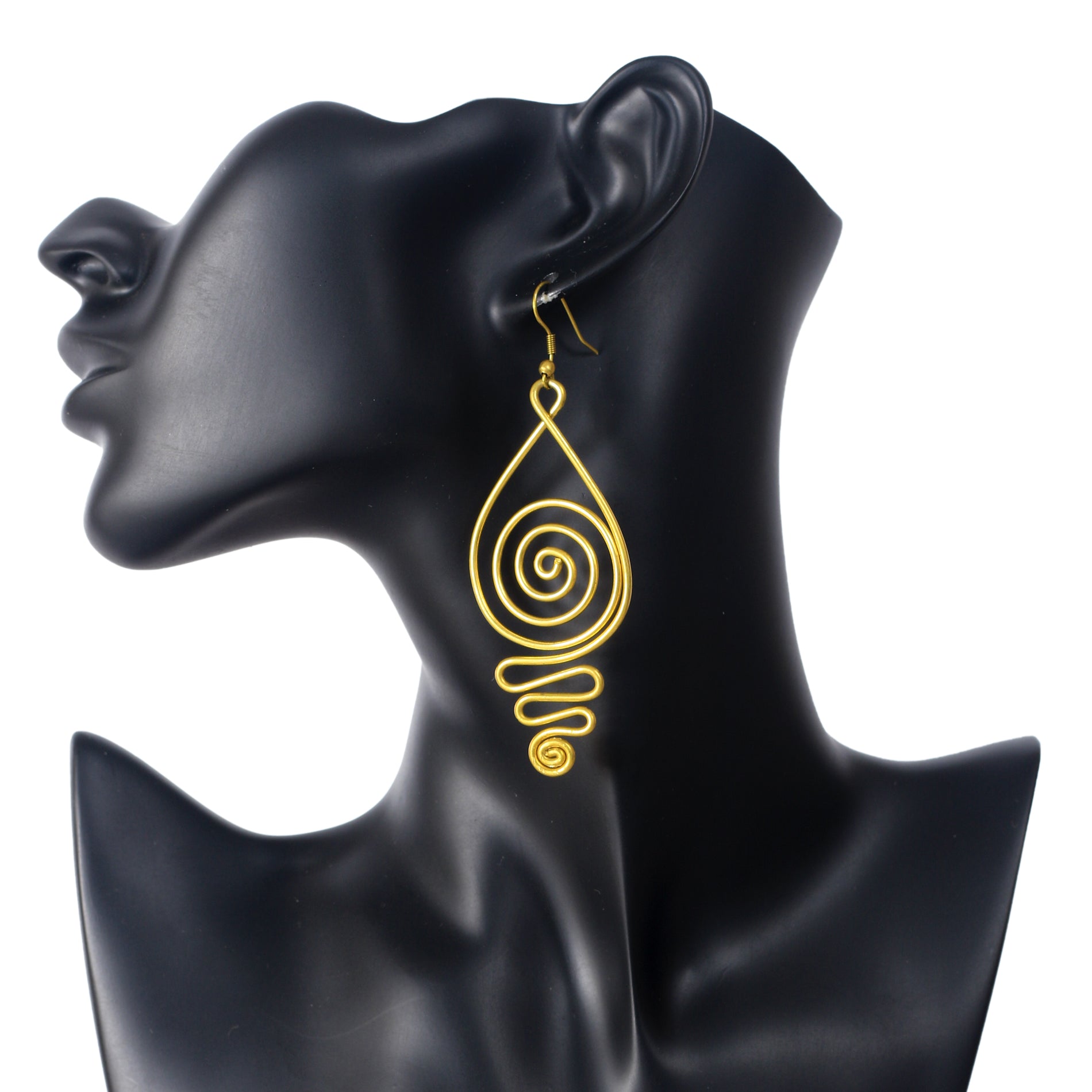 A pair of large, gold-plated wire earrings in a teardrop shape, filled with an intricate spiral pattern.