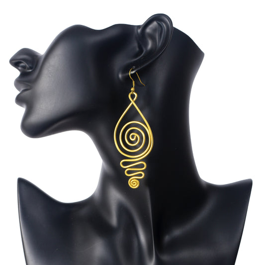 A pair of large, gold-plated wire earrings in a teardrop shape, filled with an intricate spiral pattern.