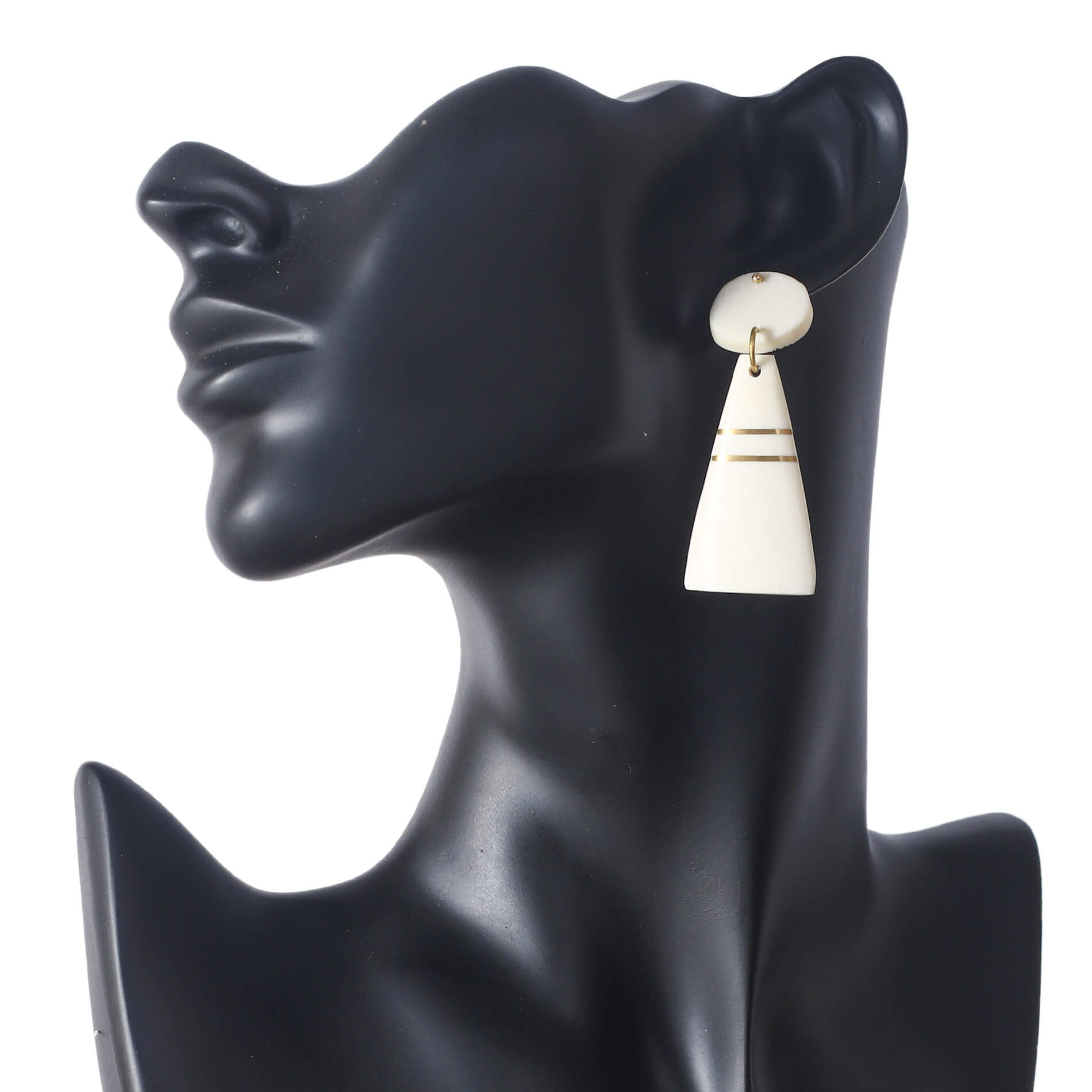 Handmade geometric camel bone earrings with an oval stud and cream tapered drop, accented with gold inlay lines.