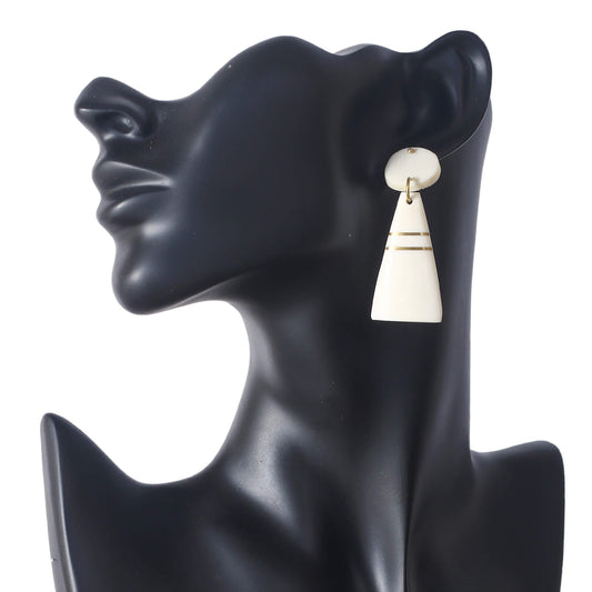 Handmade geometric camel bone earrings with an oval stud and cream tapered drop, accented with gold inlay lines.
