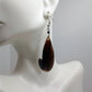 Black hanging earrings handmade with camel bone.