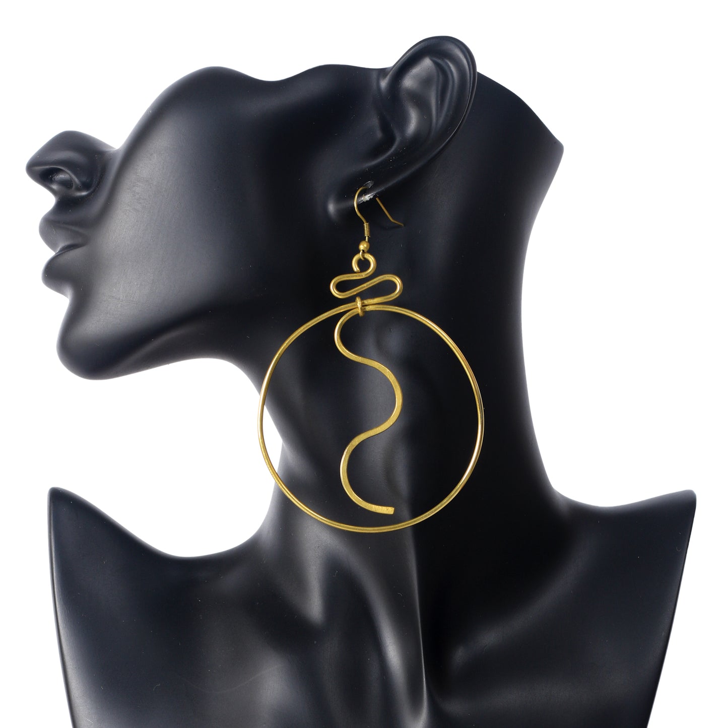 A pair of large, gold-plated hoop earrings with a fluid, S-curve wire suspended in the center.