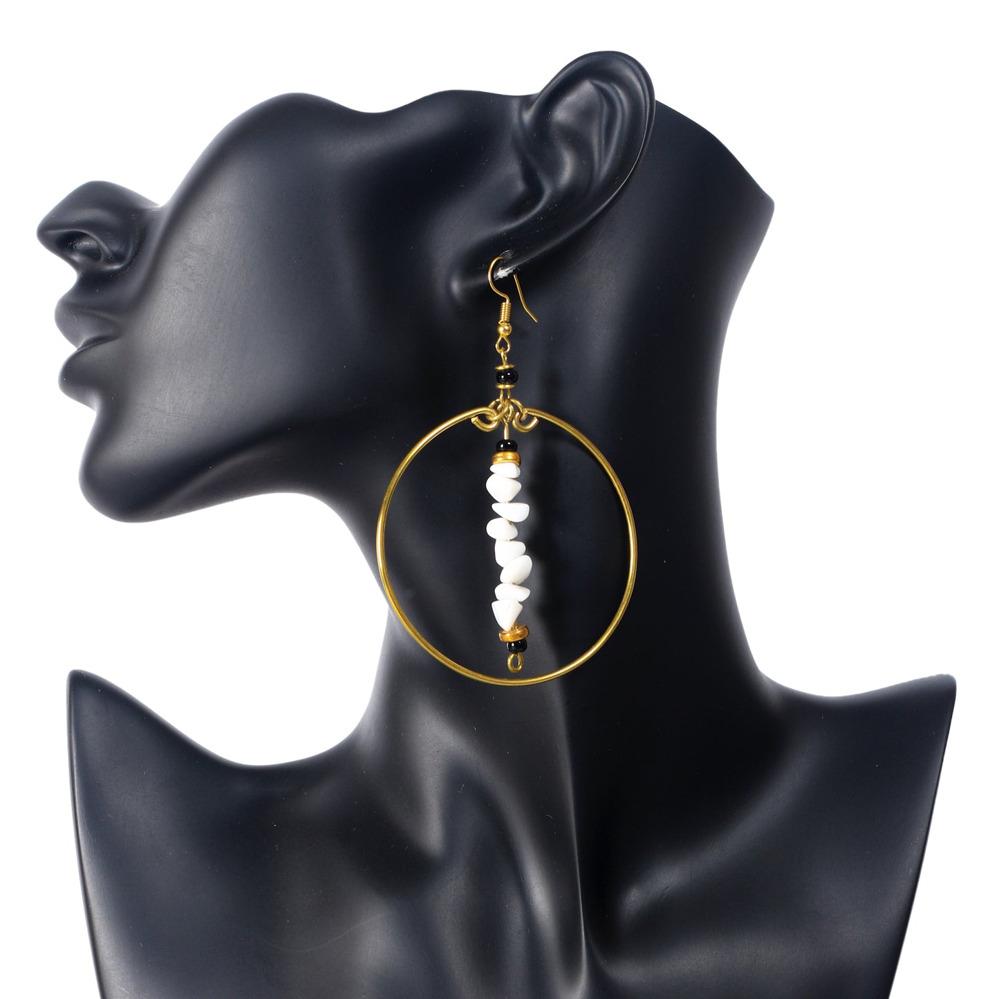 A pair of large, gold-plated hoop earrings with a central bar of white stone chips and black bead accents.
