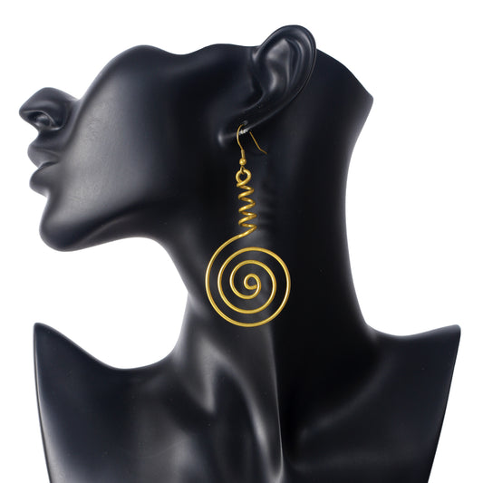 A pair of large, gold-plated wire earrings featuring a 3D conical spiral that flows into a large, flat spiral disc.