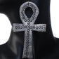 A pair of large, silver-plated Ankh symbol earrings with a stamped, textural dot pattern.