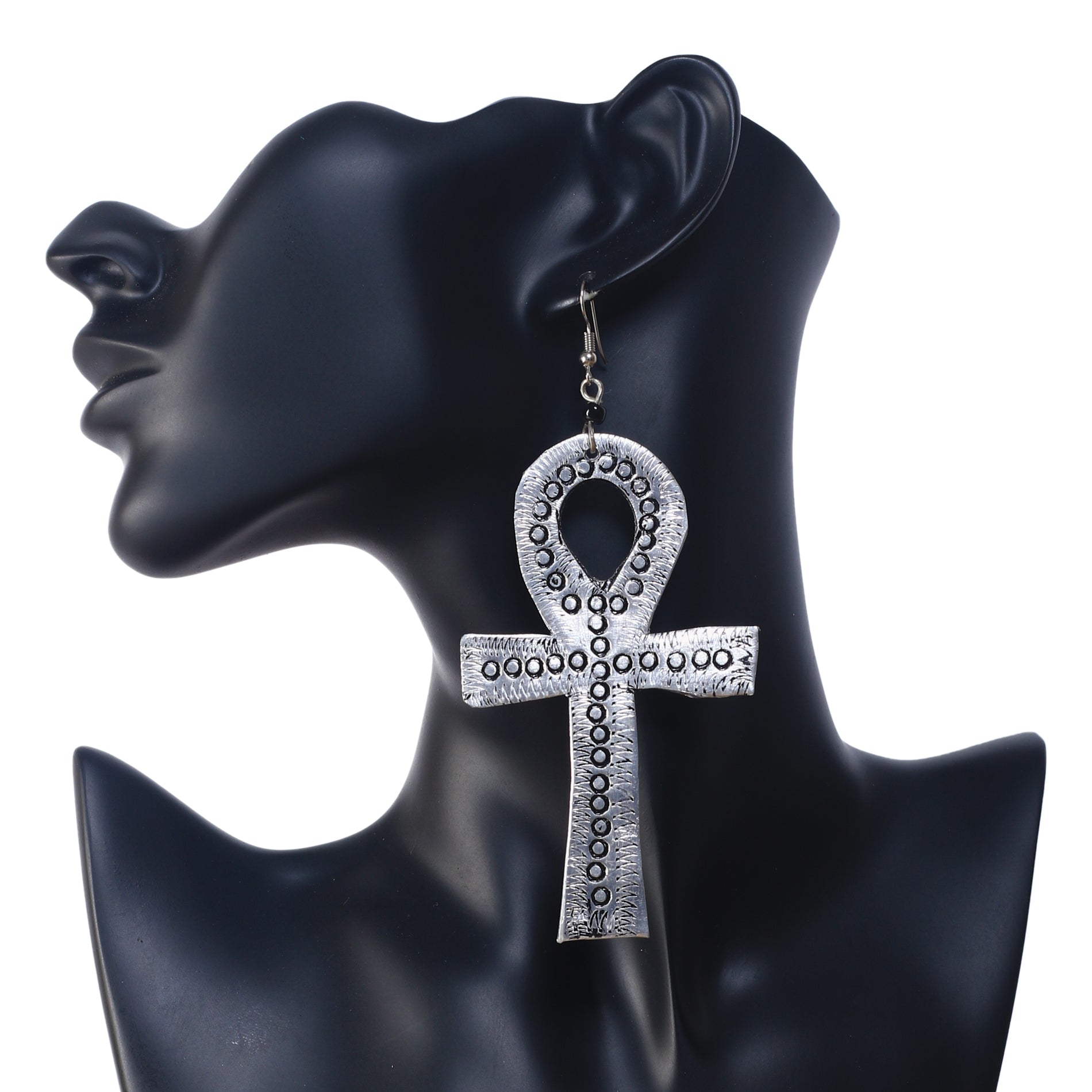 A pair of large, silver-plated Ankh symbol earrings with a stamped, textural dot pattern.