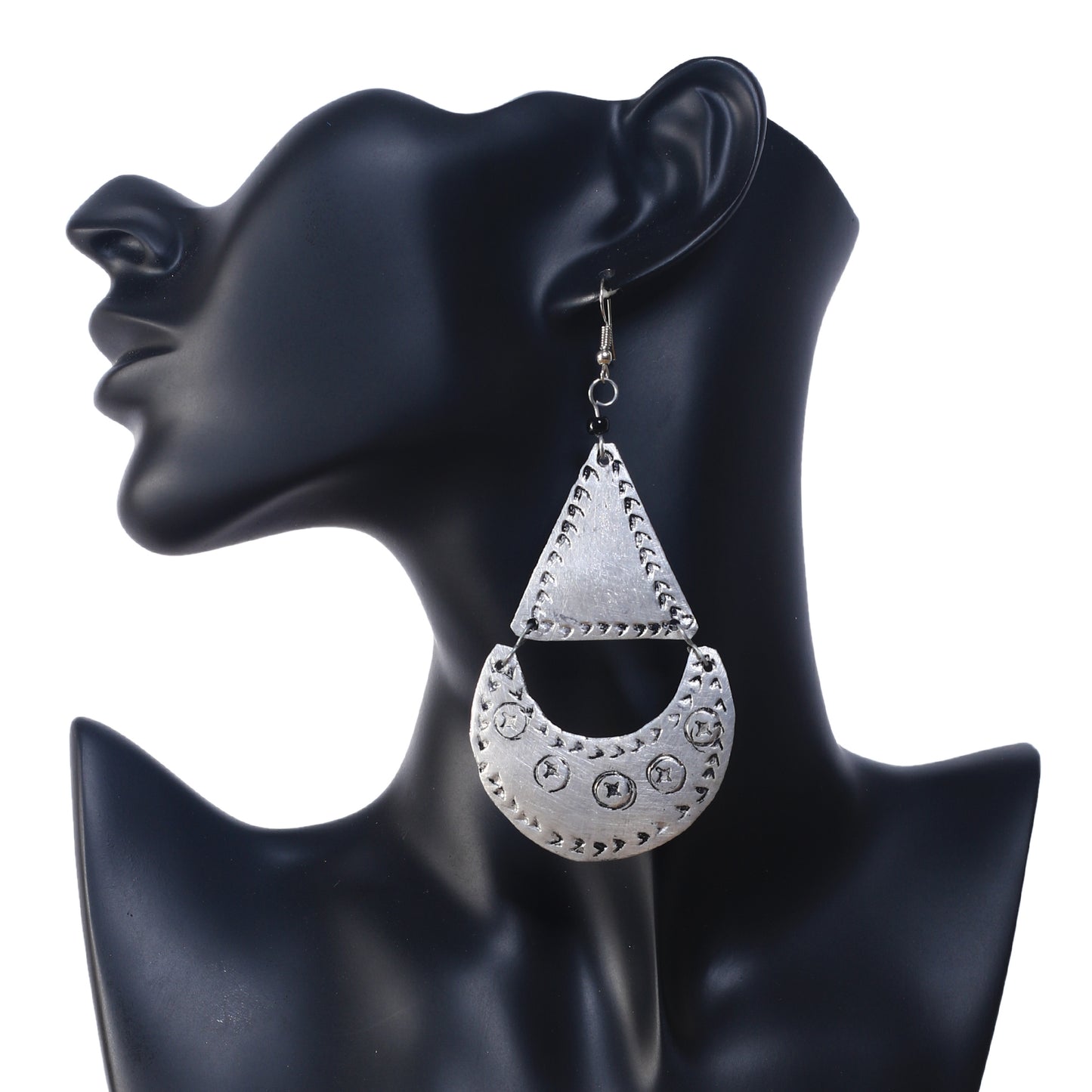 A pair of large, silver-plated geometric earrings featuring an etched triangle and a stamped crescent drop.