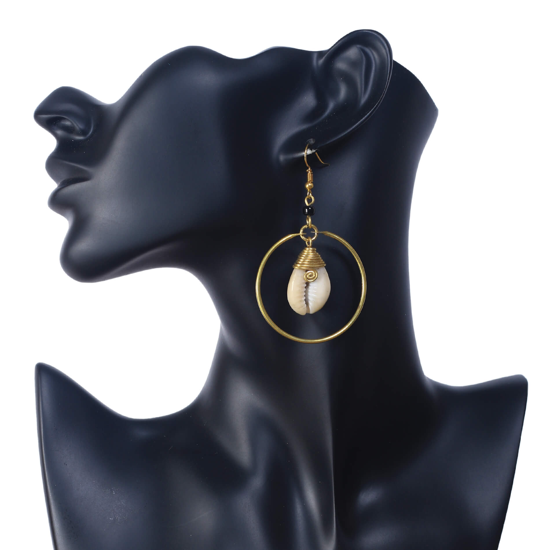 A pair of mid-sized, gold-plated hoop earrings with a single, wire-wrapped natural cowrie shell suspended in the center.
