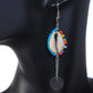 Long dangle earrings with a multicolor beaded cowrie shell, a silver-plated chain, and a round disc drop.