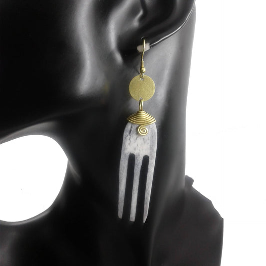 Long Earrings came with camel bone and gold plated brass. The camel bone is carved into an afro pick comb.